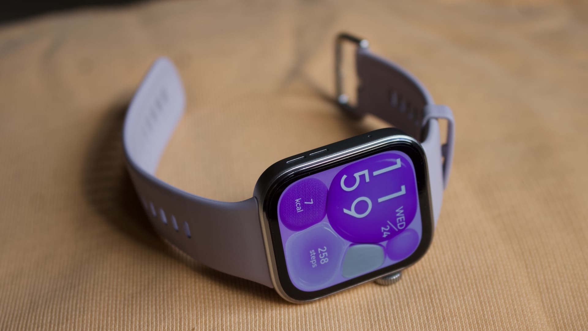 huawei watch fit 4 lifestyle image showing the watch sitting on a yellow jumper