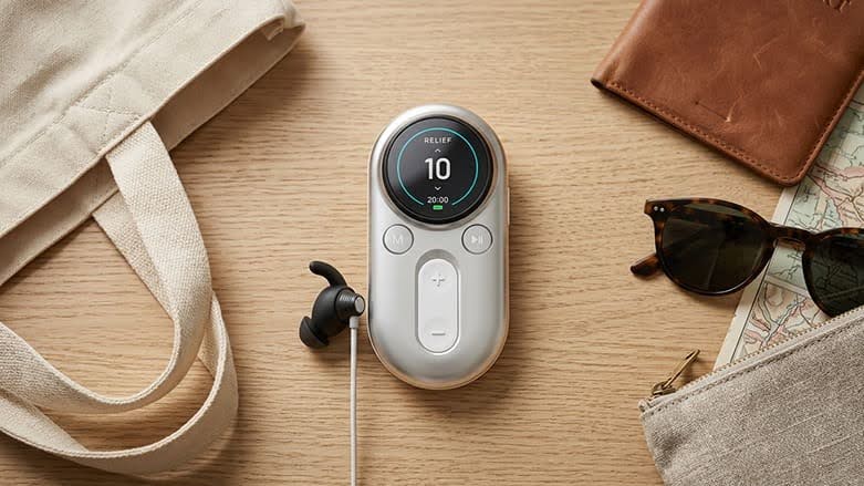 ZenoWell device alongside travel items